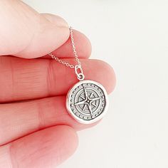 "This sterling silver wax seal compass charm necklace is full of symbolism and meaning. Because compasses are instruments used to guide explorers on expeditions and always points north, they've come to stand for guidance, inspiration, hope, motivation, and finding your way home. Compasses make wonderful gifts for friends and family embarking on new journeys marked by graduations, weddings, and good byes. Save 25% off your next purchase, sign up here: www.justjaynes.com/sign-up LISTING IS FOR: - Affordable Gift Jewelry With Compass Design, Round Pendant Medallion Necklace With Compass Design For Gift, Medallion Necklace With Compass Design For Gift, Compass Design Pendant Jewelry As Gift, Silver Medallion Necklace For Travel, Gift Medallion Necklace With Compass Design, Gift Compass Design Round Pendant Medallion Necklace, Compass Design Medallion Necklace Gift, Compass Design Pendant Jewelry Gift