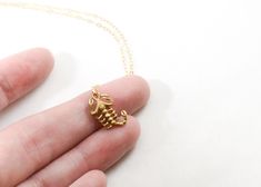 This matte finished solid brass scorpion is featured on fine, sparkling 14k gold filled chain - and arrives gift ready for the scorpio in your life, yourself, or anyone fascinated by the flourescing creature of the night. SOLID brass pendant + 100% 14k gold filled chain and components *solid brass is an excellent, sturdy metal that will last you a lifetime. To keep it looking its best polish with a jewelry cloth every now and then. If your necklace ever begins to develop a patina, deeper cleanin Scorpion Necklace, Zodiac Sign Scorpio, Zodiac Signs Scorpio, November Birthday, Brass Pendant, Necklace Sterling Silver, Gold Filled Chain, Scorpion, Zodiac Sign