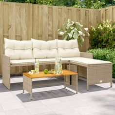 a couch and table sitting on a patio