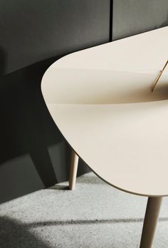 a white table with an odd shaped design on it