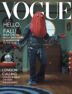 a woman with red hair is standing on the cover of a magazine