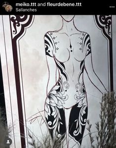 a painting on the side of a building with an image of a naked woman in black and white