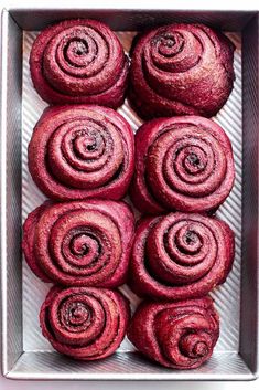 red velvet rolls in a metal baking pan