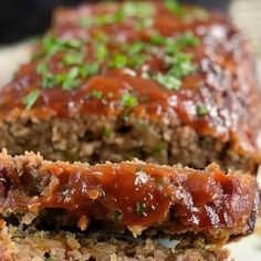 sliced meatloaf with sauce and parsley on top