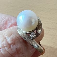 Stunning Vintage Ring In Solid 14k White Gold ( Stamped & Tested). When I Purchased It At The Rstate Sale, I Loved Everything About This Ring: The Heafty Chunky Setting, The Sparkling Diamonds On The Side, But The Pearl Was Dull So, My Jeweler Sent Me To The Pearl Wholeseller In The Nyc Jewelry District And Together We Chose This Beautiful, Round, White, Large 10mm Pearl For This Setting. When My Jeweler Set This New Pearl Into This Beautiful Vintage Setting, Its As If She Was Always There : A Perfect Match !!! Each Side Diamond Is Approx 2.3 Mm In Size , Genuine, Tested, I Do Not Have Color/ Clarity Info. Naked Eye Very Sparkly!!! So, This Is Truly A One Of A Kind Ring !!! Formal Brilliant Cut Pearl Ring In Platinum, Formal Diamond White Pearl Ring With Diamond Accents, Diamond White Oval Pearl Ring For Anniversary, Oval Brilliant Cut Pearl Ring For Formal Occasions, Formal Oval Pearl Ring With Brilliant Cut, Pearl Ring With Prong Setting For Anniversary, Fine Jewelry Round Cut Pearl Ring For Anniversary, Formal Brilliant Cut Pearl Ring, Classic White Gold Pearl Ring With Diamond Accents