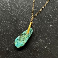 Our December birthstone is TURQUOISE, and once again we have some lovely gemstones to use in our earrings and necklaces! This beautiful, raw Turquoise gemstone is 1 1/4" tall x 9/16" wide x 1/4" thick. It is suspended from our small 24K GOLD VERMEIL Bail, wrapped with 14K gold wire, and it hangs from an 16"/18" adjustable 14K GOLD fill chain. Turquoise is perhaps the oldest decorative stone in mankind's history, the Taliswoman of Kings and Queens, Shamans, and Warriors. It is a stone of protecti Artisan Turquoise Necklace, One Of A Kind, Gift, Rustic Turquoise Hand-strung Necklace, Hand-strung Turquoise Pendant Necklace, Artisan Hand-strung Turquoise Necklace Gift, Spiritual One-of-a-kind Turquoise Pendant Necklace, Raw Turquoise, Jewellery Showroom, Kings And Queens, Throat Chakra