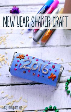 a new year shaker craft made out of toilet paper and colored crayons