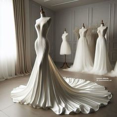 a white dress on display in front of mannequins and other gowns