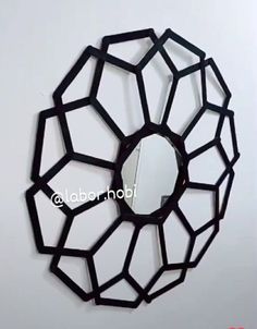 a mirror that is on the wall with some sort of object in front of it