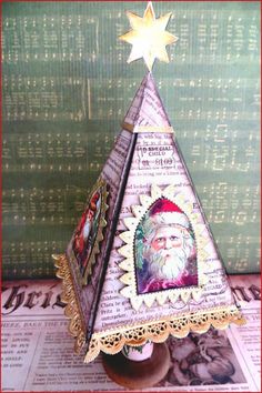 a paper christmas tree with a santa clause on it