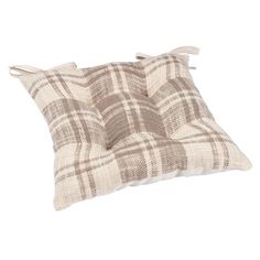 a brown and white plaid pillow on a white background