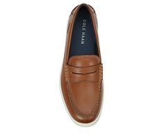 Cole Haan Nantucket Men s Penny Loafer Cool your coastal vibes in the yacht-rock ready Cole Haan Nantucket men s penny Loafer. With a leather upper featuring a beefroll keeper detail for extra preppy style, this Slip-On also has a soft moc toe. The footbed cushions every step while the outsole adds durability and flexibility. Leather upper Slip-On Moc toe EVA footbed Rubber traction outsole Casual Boating Loafers With Plain Toe, Casual Plain Toe Loafers For Boating, Casual Boat Shoes For Business With Moc Toe, Classic Slip-on Loafers For Boating, Casual Slip-on Boat Shoes For Business, Casual Brown Loafers For Boating, Casual Round Toe Loafers For Boating, Casual Brown Wingtip Loafers, Casual Plain Toe Boat Shoes For Work