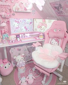 a room with hello kitty furniture and accessories on the walls, including a pink chair