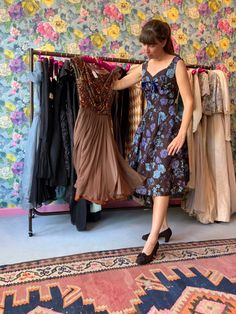 Lucy pulling out a glamourous 1960s party dress in the most delicious mocha chiffon and velvet! The bodice is scattered with gold sequins and red accent velvet for depth and excitement. Vintage cocktail dresses don’t get much better than this! Lucy is wearing another 60s occassion dress, in stunning blue floral silk. Available in store or per online request 💫 Vintage Cocktail Dresses, Vintage Evening Dresses, Occassion Dress, 1960s Party, White Beaded Dress, Blue Chiffon Dresses, Evening Dress Collection, Chiffon Cocktail Dress