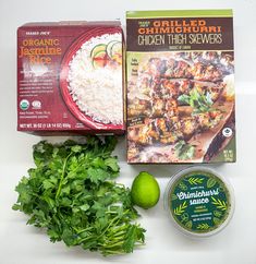 ingredients for chicken tikkas laid out on a white counter top, including rice, cilantro and lime