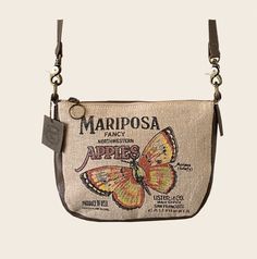 Mariposa Apple Crate Crossbody       American Glory are meticulously handcrafted Handbags & Accessories, inspired by history... vintage posters, advertisements and burlap sack designs are nostalgic and gives a connection to America's past. This petite but roomy pouch can fit all your essentials, cell phone fits in front insert pocket, wallet in the main body and keys/essentials in zippered pocket, not to mention there is a back outside zippered pocket.  Crossbody straps are removable so you can Vintage Beige Bags Perfect For Gifts, Vintage Satchel Bag As Gift, Vintage Pouch Shoulder Bag As Gift, Retro Bags With Zipper Pouch As Gift, Vintage Crossbody Flap Bag, Vintage Pouch Shoulder Bag For Gift, Rectangular Upcycled Bags As Gifts, Rectangular Upcycled Bags For Gifts, Retro Bags With Zipper Pouch For Gifts