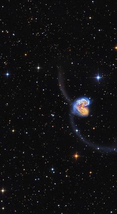 an image of a spiral galaxy in the sky