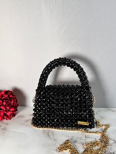 Sleek, chic, and a touch of sparkle - this black beaded bag is your go-to for an effortlessly stylish look.  Dimension: Width: 17.5cm Height: 11cm Depth: 7cm The bag comes with a detachable handle which measures 110cm. Feel free to contact me for any questions. Chic Rectangular Sequined Evening Bag, Elegant Party Bag With Black Beads, Chic Beaded Bags For Night Out, Black Evening Bags With Sequins, Black Top Handle Clutch For Party, Black Sequined Bags For Formal Occasions, Elegant Party Bags With Black Beads, Black Top Handle Shoulder Bag For Events, Chic Black Embellished Bags