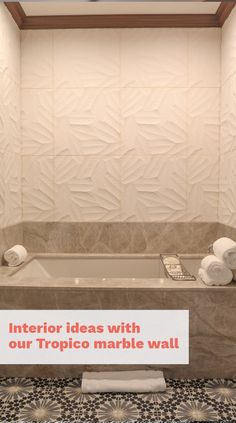 there is a sign that says interior ideas with our tropic marble wall in the bathroom