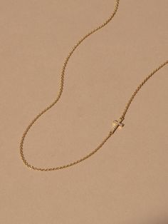 This small, studded cross pendant affixed to a simple gold chain is the finishing touch to any look. Crafted with 18k gold over sterling silver and real, slightly included round-cut diamonds, this is a dainty necklace you’ll want in your collection forever. Pair our Side Cross Vermeil Necklace with our Cross Vermeil Huggies for a full Vermeil look. | Gold Vermeil Side Cross Chain Necklace | Women's Jewelry by Uncommon James 14k Gold Cross Necklace With Adjustable Chain, 14k Gold Filled Cross Necklace With Delicate Chain, Minimalist Tarnish Resistant Yellow Gold Cross Necklace, Minimalist Yellow Gold Cross Necklace With Clavicle Chain, Dainty Yellow Gold-plated Cross Necklace, Minimalist Tarnish-resistant Yellow Gold Cross Necklace, 14k Gold-filled Yellow Gold Cross Necklace As Gift, Simple Gold Chain, Elegant 14k Gold-filled Cross Pendant Necklace