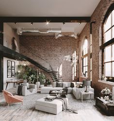 a living room filled with lots of furniture next to a brick wall covered in windows