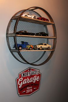 there is a metal rack with cars on it and a sign that says garage above it