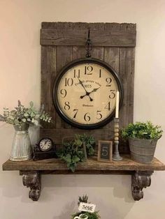 a clock mounted to the side of a wall above a shelf filled with potted plants