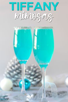 two glasses filled with blue liquid and the words tiffanyy minnesota on top of it