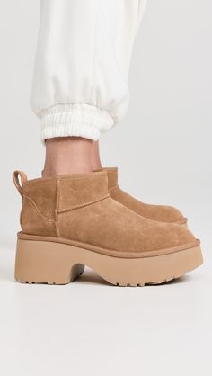 Find UGG Classic Ultra Mini New Heights Boots on Editorialist. Cannot be shipped outside the USA Upper: Cowhide suede. Lining: Wool sherpa. Chunky heel. No closure, pull-on design. Round toe. Rubber sole. Imported, Vietnam. This item cannot be gift-boxed. Measurements: Platform: 2.75in / 70mm Ugg Heels, Ugg Shoes Women, Brown Ugg Boots, Chestnut Boots, Chestnut Uggs, Ugg Classic Ultra Mini, Ugg Mini, Chunky Heels Boots, Ugg Classic