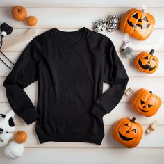 Featuring a flat lay black Gildan 18000 sweatshirt mockup looking all ready for your Halloween store !  This mockup template is perfect for anyone in the Print On Demand industry or looking for a simple and stylish lifestyle mockup. With this digital download, you'll have access to a high-quality image that'll be sure to make your shop stand out and sell those shirts! Don't wait, add this beautiful mockup to your collection today!  Available colors: Black Mockup Details:  Brand:  Gildan 18000 ATTN: Although most colors should match the mockups on Printify and Printful, there may be a few that are slightly off. If you encounter any issues with the color you want to use, please send me a message and I will work with you to find a solution.  This is an instant download with no physical item t Black Cotton Halloween Sweater, Spooky Black T-shirt For Winter, Spooky Long Sleeve Black Sweater, Spooky Black Long Sleeve Sweater, Black Long Sleeve Halloween Sweatshirt, Black Long Sleeve Sweatshirt For Halloween, Casual Black Halloween Sweater, Casual Black Sweater For Halloween, Black Halloween Sweatshirt With Crew Neck