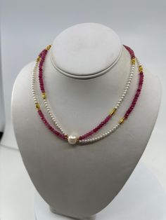 New handcrafted double strand necklace, a perfect symphony of pink faceted tourmaline and delicate white baby pearls. This exquisite piece is designed to bring a touch of quiet luxury to any outfit, ideal for those who appreciate the finer details in life. Measurements and Materials:         *       Tourmaline: 3mm faceted rondelles, showcasing a vibrant pink hue that captures the beauty of fall.         *       Pearls: White freshwater baby pearls ranging from 2 to 3mm, meticulously selected fo Luxury Faceted Double Strand Beaded Necklaces, Luxury Double Strand Beaded Pearl Necklace, Luxury Beaded Double Strand Pearl Necklace, Multi-strand Faceted Beads Pearl Necklace As Gift, Handmade Double Strand Pearl Necklace, Watermelon Tourmaline Necklace, Baby Pearls, Double Strand Necklace, Tourmaline Necklace