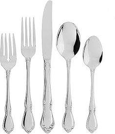 an assortment of silverware including forks, knives and spoons on a white background