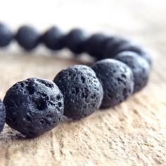 "This genuine black lava stone bracelet will become your go-to everyday bracelet to wear alone or stack with others. As part of a collection of bracelets in various genuine gemstones that you'll find yourself reaching for with every outfit in your wardrobe that can also be taken from day to evening. The 8mm beads are shown in the video. Both bead sizes (8mm + 10mm) shown modelled side by side in images. {LISTING FEATURES} ~ Exotic bohemian style ~ Genuine black lava stone beads ~ Choice of 8mm o Mini Rosaries, Mens Bracelet Black, Lava Rock Bracelet, Daily Accessories, Christian Bracelets, Lava Stone Bracelet, Cross Christian, Bead Sizes, Lava Bracelet