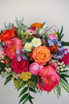 a bouquet of colorful flowers on a white background