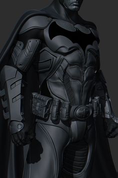 a man dressed as batman standing with his hands in his pockets and wearing a black suit