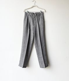 A pair of 1990s grey suit pants. Straight leg- mid rise. Zipper and latch button closure at waist. Brand is colter Waist 28 rise12 hips inseam 28 outer39.5 Classic Gray Pants For Spring, Gray Flat Front Bottoms For Business Casual, Gray Flat Front Business Casual Bottoms, Gray Bottoms With Button Closure For Spring, Classic Gray Tapered Leg Bottoms, Gray High Waist Pants For Formal Occasion, Fitted Gray Work Pants With Welt Pockets, Gray Flat Front Pants For Business Casual, Vintage Straight Leg Bottoms For Business Casual