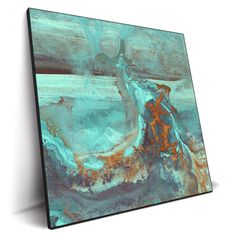 an abstract painting with blue, orange and brown colors on the canvas is displayed in front of a white wall