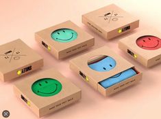 six boxes with different designs on them and one has a smiley face in the middle