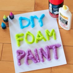 the word diy foam paint spelled out on a piece of paper