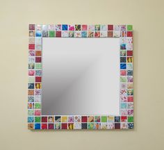 a mirror that has been made out of different colored tiles on the side of it