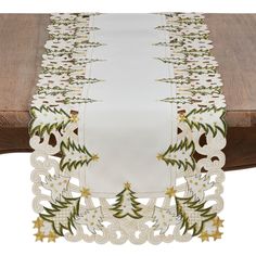 a table runner with christmas trees on it