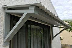 an awning on the outside of a house