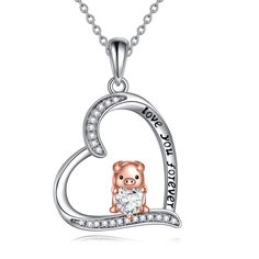 PRICES MAY VARY. ❤️Lovely Pig Heart Necklace Design: Cute piggy holding the heart CZ pendant necklace, and the heart pendant is engraved with "Love You More" Perfect as a Gift to Express the Love Message I love you more for The beloved ones girlfriend wife mom daughter. ❤️The Rose Gold Pig Pendant will bring you good luck and happiness Be Happy Everyday! Perfect as Birthday, Mother's Day, Valentines-day, Thanksgiving Day, Christmas, Graduation, Encouragement, Friendship Gifts for Women, Girls, T Pig Necklace Jewelry, Panda Pendant, Pig Heart, Graduation Gifts For Sister, Pig Necklace, Animal Pendant, Forever Jewelry, Necklace Design, Cz Necklace