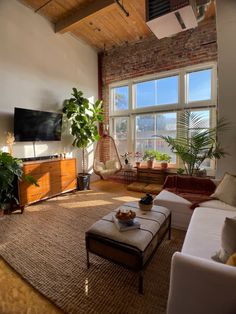 a living room filled with furniture and a flat screen tv