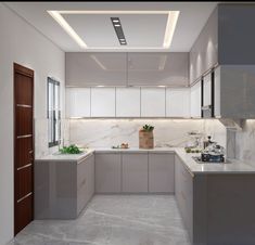 a modern kitchen with marble counter tops and white cabinets, along with an island in the middle