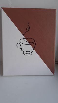 a coffee cup is drawn on the side of a canvas