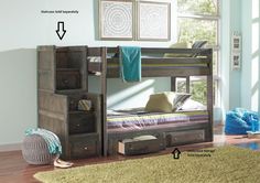 a bunk bed sitting on top of a hard wood floor next to a green rug