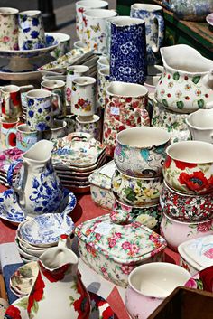 a table topped with lots of different kinds of dishes