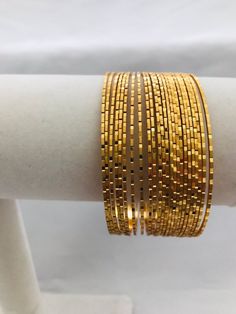 Plain gold glitter set of twenty four bangles Handmade jewelry Silver plated jewelry * *  * Actual product color may vary slightly due to screen resolution and digital photography. Latest Gold Bangles, Bangle Collection, Plain Gold Bangles, Gold Bangles Indian, Jewelry Bangles, Bridal Jewels