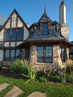 a large house with stone and wood accents